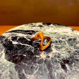 Rose gold coloured stackable ring.